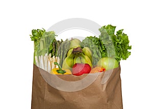 Grocery bag of produce, fruits and veggies isolated on white