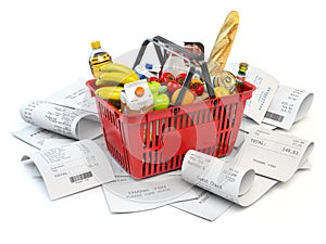 Grocery expenses budget  and consumerism. Shopping basket with foods on the pile of receipt isolated on white