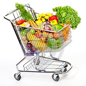 Grocery shopping cart with vegetables and fruits.