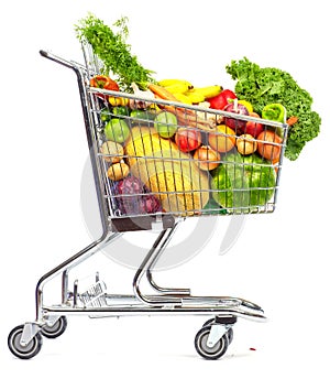 Grocery shopping cart with vegetables and fruits. photo