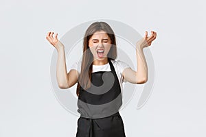 Grocery store employees, small business and coffee shops concept. Distressed and pissed-off female barista losing temper