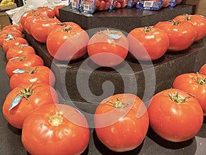 Grocery store tomatoes on a display