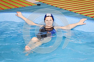 GRODNO, Belarus - Health resort Porechye. Beautiful woman bathes in the pool.