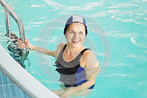 GRODNO, Belarus - Health resort Porechye. Beautiful woman bathes in the pool.