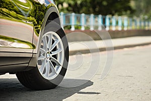 GRODNO, BELARUS - JUNE 2020: BMW X3 II F25 2.0i xDrive wheel alloy wheels with summer tires with BMW logo closeup on