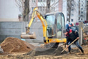 Grodno, Belarus - November, 22 2021: JCB 8018 CTS excavator digging sand and concrete at construction site with