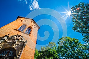 Grodno Castle surrounded by greenery under the sunlight and a blue sky in Zagorze, Poland