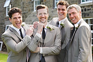 Groom With Best Man And Groomsmen At Wedding