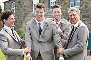 Groom With Best Man And Groomsmen At Wedding