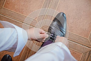 Groom black elegant shoes. Wedding detail. Close up