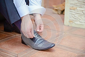 Groom black elegant shoes. Wedding detail. Close up