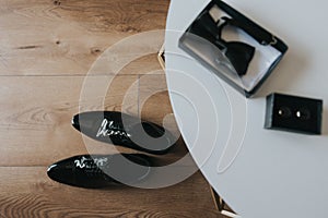 Groom black elegant shoes. Wedding detail. Close up