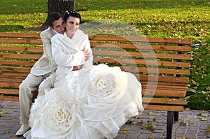 Groom and bride on the bench