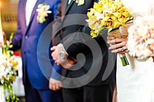 Groom and Bride holding bouquet