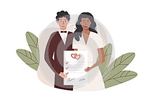 A groom and bride holding signed marriage contract. Interracial married couple with prenup document. Newlywed with photo