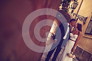 Groom and bride kissing