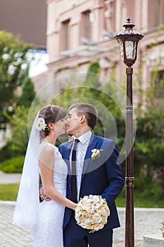 Groom, bride kissing stay