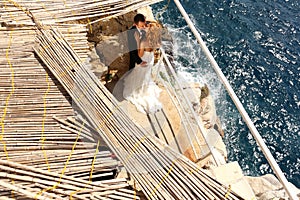 Groom and bride near the sea