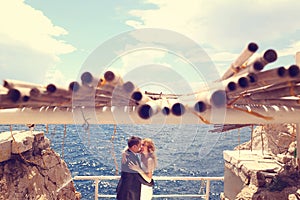 Groom and bride near the sea