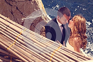 Groom and bride near the sea