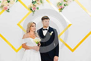 the groom and the bride at the official wedding ceremony