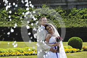 Groom and bride in park background photo