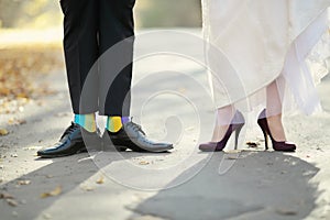 Groom and bride showing their shoes