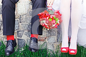 Groom. bride, wedding shoes, red