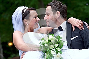 Groom is carrying his bride