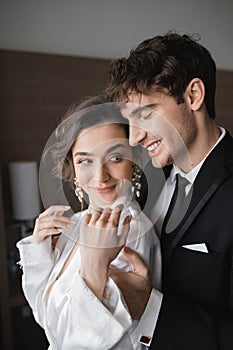 groom with closed eyed in classic