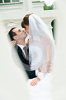 Groom embracing bride and kiss nose. Love couple