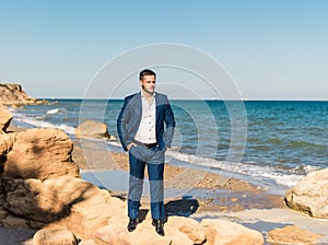 Groom getting ready in the morning for wedding ceremony on the beach