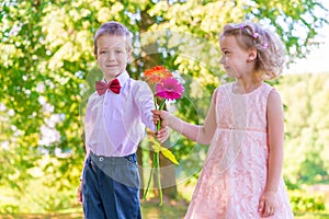 Groom gives a little girl a bouquet