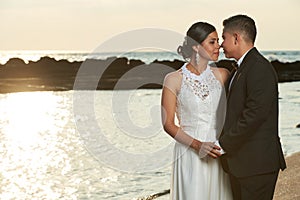 Groom going to kiss bride