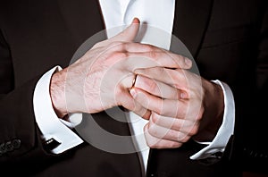 Groom hands takes off a ring