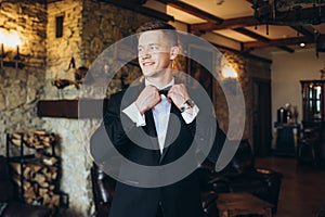 The groom and his friends celebrate the wedding. Men in suits. Murzhsky emotions and friendship.