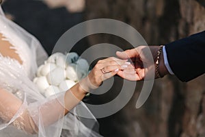Groom hold bride`s han. Close up of hands. Beautiful