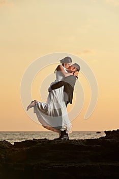 Groom hold and kiss bride