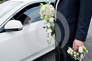 Groom holding a wedding bouquet