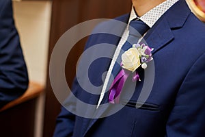 Groom in a jacket with a buttonhole