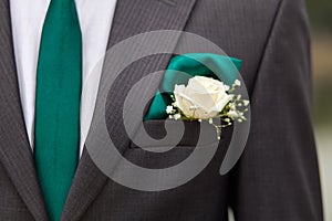 Groom jacket with green tie