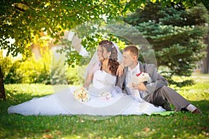 The groom kisses the bride