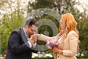 Groom kissing bride`s hand