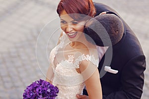 Groom kissing his bride