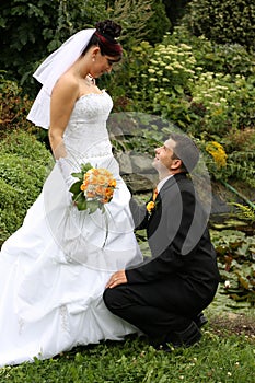 Groom on knees