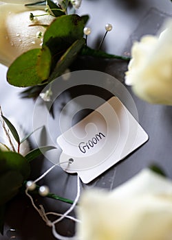Groom label on wedding corsage favour flower