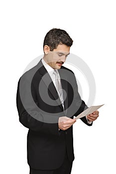 Groom looking at marraige license