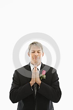 Groom praying.