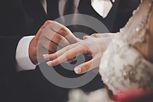 Groom Putting Ring On Bride`s Finger