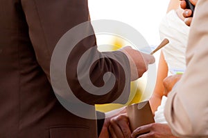 Groom Reading Vows to Bride